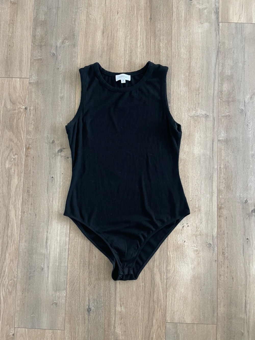 Black Ribbed Sleeveless One-Piece Bodysuit